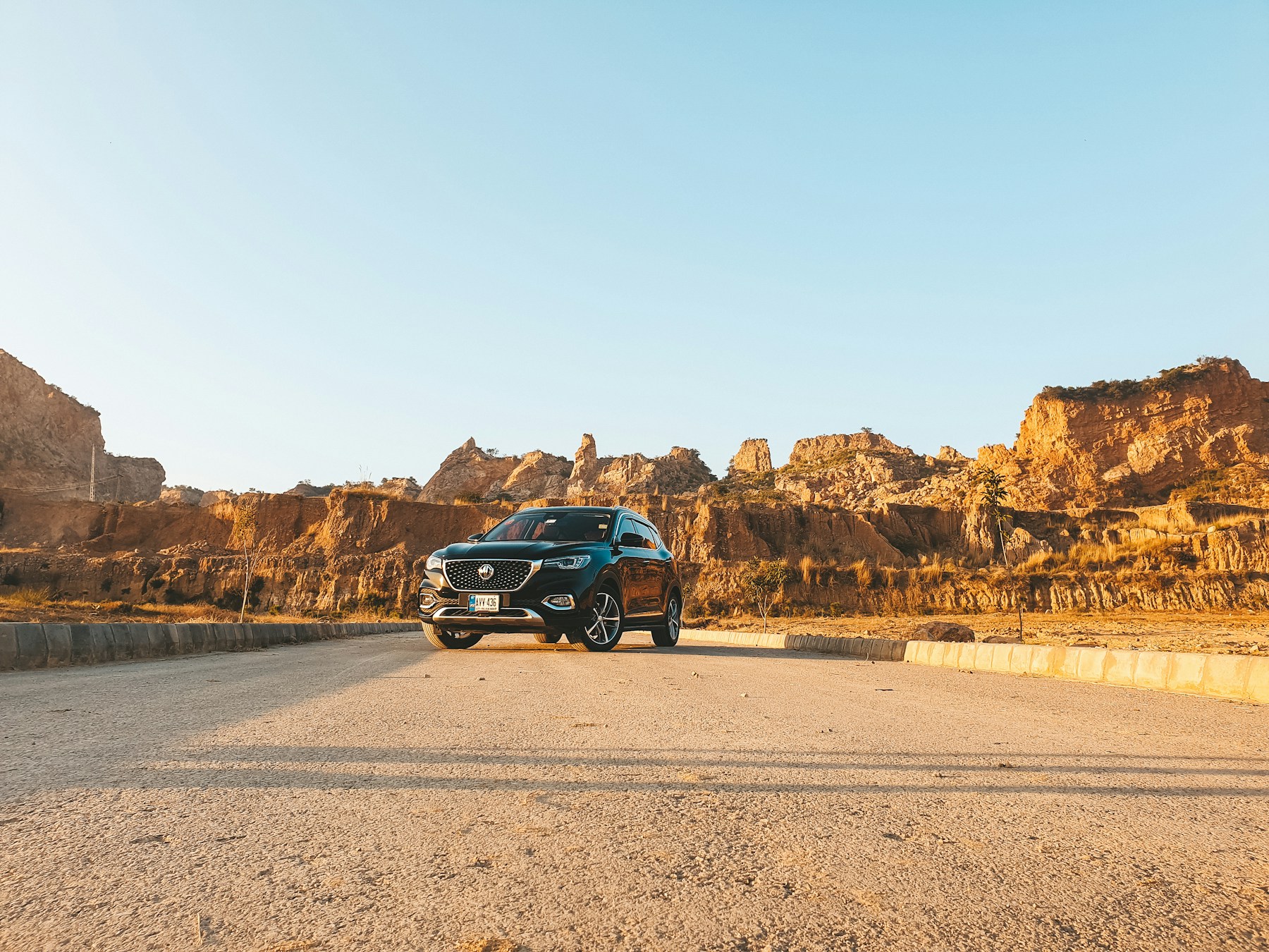 SUV beside a mountainous landscape
